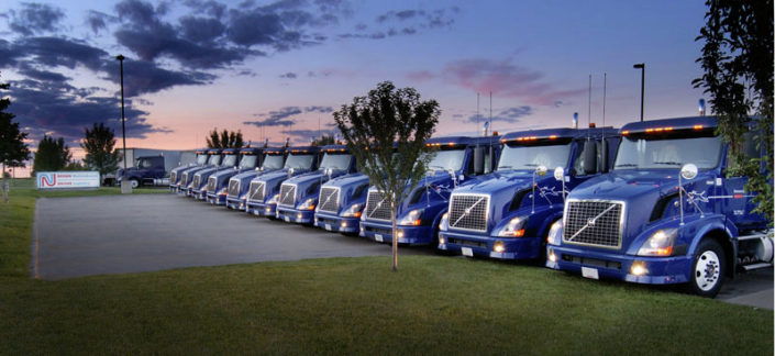 Truck photography, artistic lign up of trucks, photo taken at sunset of trucks with lights on