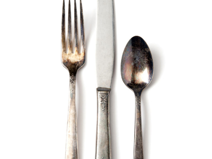 Tarnished place setting silverware